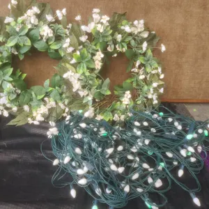 2 Floral Wreaths with White Flowers and String of White Outdoor Lights