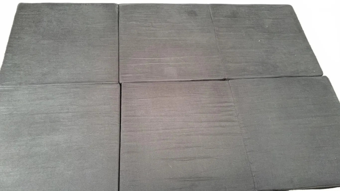 Six Black Foam Floor Cushions