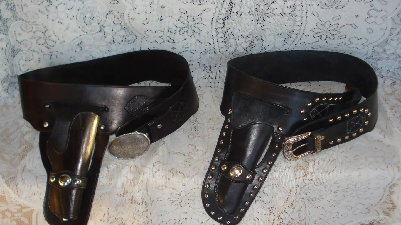 Pair Of Leather Old West Style Holsters With Silver Colour Accents Used As Props In Film