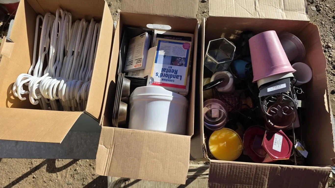 3 boxes of misc items- hangers