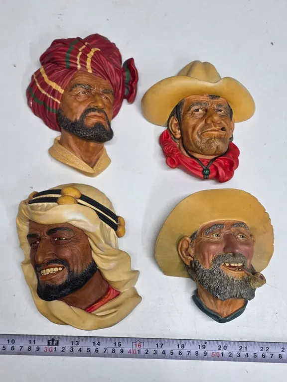 4 chalkware heads