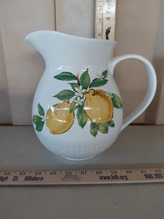 At Home Lemon Pottery Pitcher 9", Small Chip