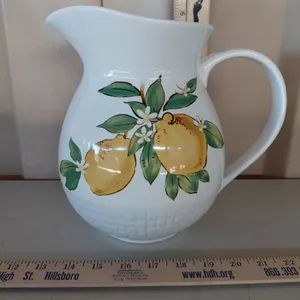 At Home Lemon Pottery Pitcher 9", Small Chip