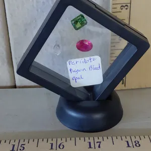Peridot, Pigeon Blood, & Opal In Display Case