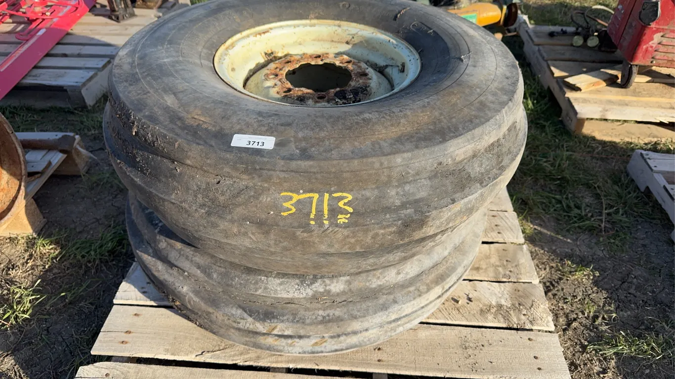 Pair of implement tires/rims 11.00-16 (some checking)