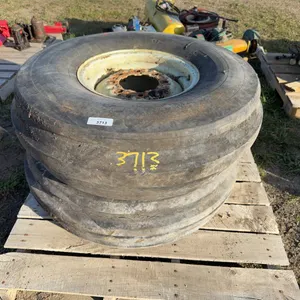 Pair of implement tires/rims 11.00-16 (some checking)