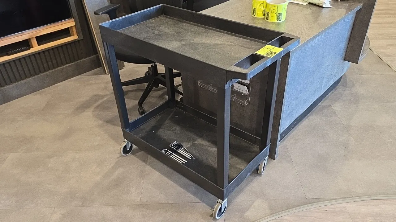 Poly 2-tier utility cart. Features molded plastic construction with two tub shelves and an integrated push handle with storage wells. 3'L. Mounted on