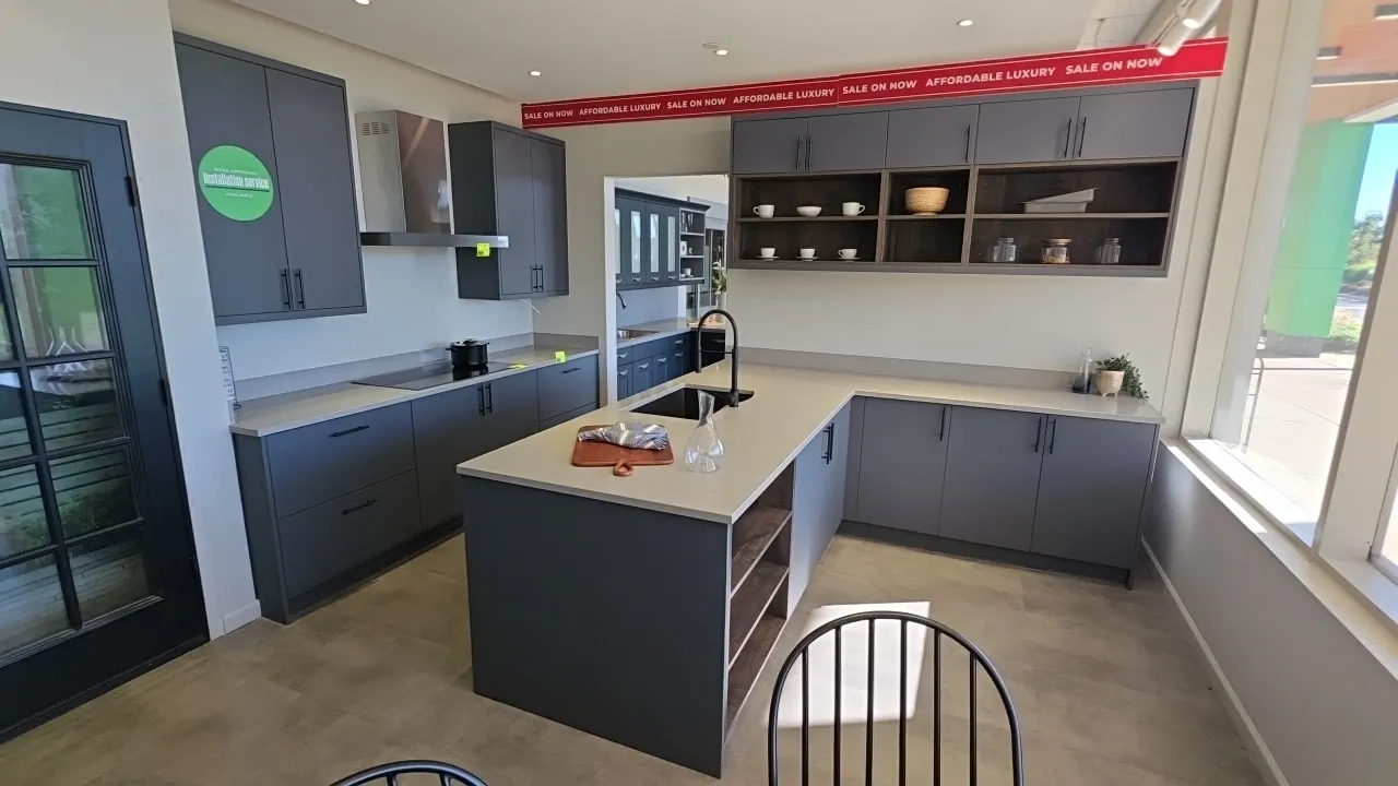 Infinity Plus kitchen cabinet set. Includes 105"L upper and lower cabinets with solid surface countertops, 104" x 99" L-shaped cabinet run with underm