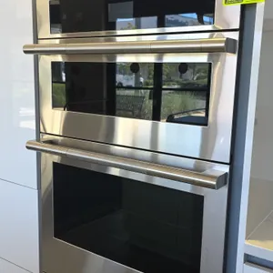 2023 JennAir JMW2430LL03 30" built-in combination wall oven. Features stainless steel finish with glass door panels, knurled bar handles, digital touc