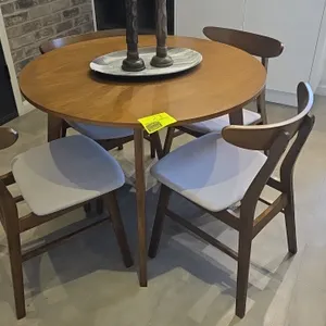 Laminate wood dining table set. Includes round dining table and (4) matching chairs with cushioned fabric seats and wood frames. Dimensions: 40" x 30"