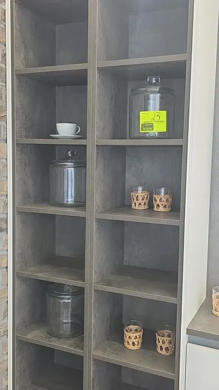 Assorted smallwares and decorative accents. Includes (3) lidded glass storage jars, stainless steel tea kettle, wooden serving board, metal ring sculp