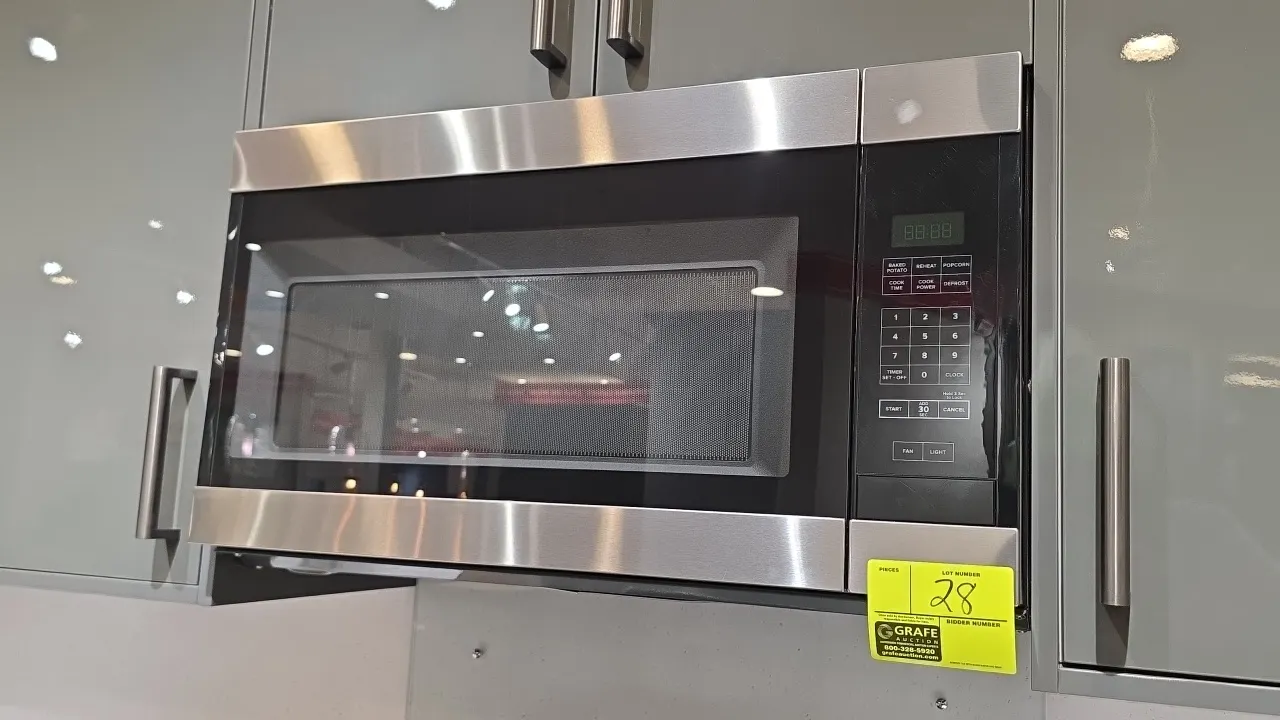 2021 Whirlpool AMV2307PFS07 built-in microwave oven. Features stainless steel trim, digital keypad display, interior glass turntable, and integrated u