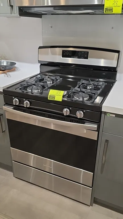 Amana AGR6603SFS4 4-burner natural gas range. Features stainless steel finish, cast burner grates, electronic control panel, glass oven door with view