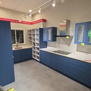 Infinity Plus U-shape upper and lower kitchen cabinets. Features solid surface countertops, backsplash, stainless steel sink with faucet, open shelvin