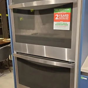 GE Profile PTD7000SN3SS built-in double wall oven. Features stainless steel exterior with glass front doors, touchscreen display with Wi-Fi Connect, a