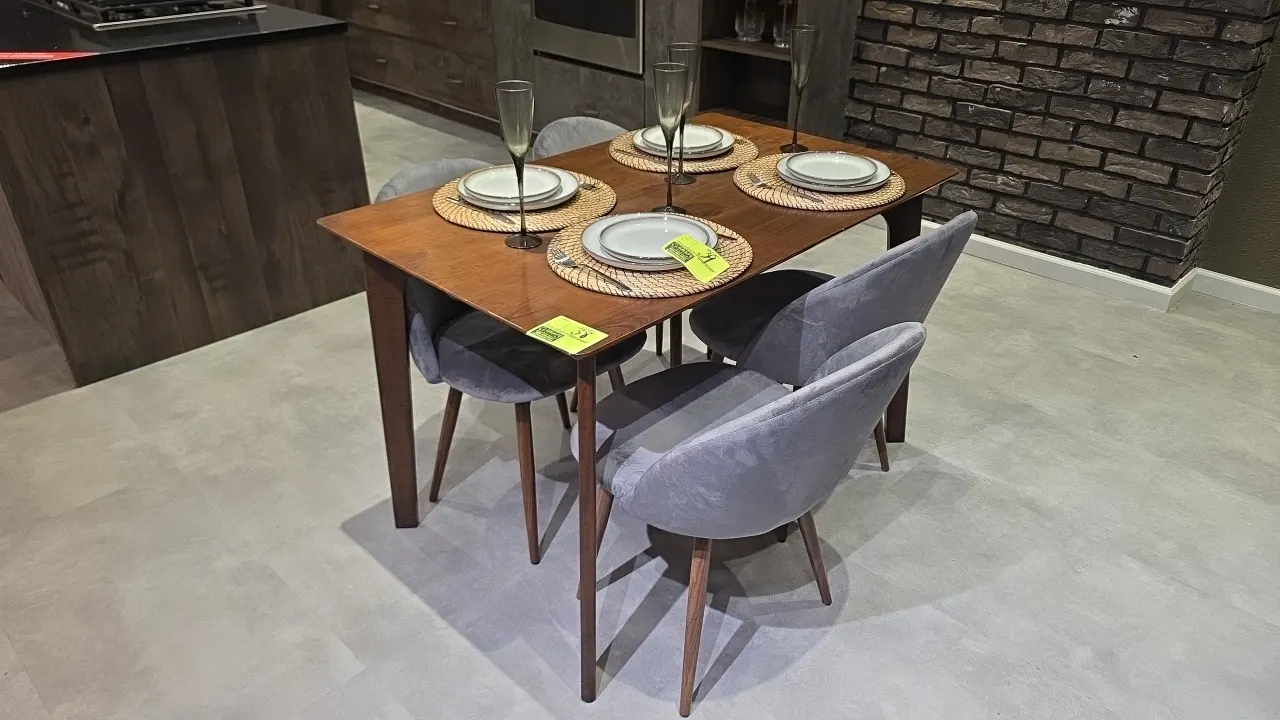 Wood dining table and chairs set. Includes rectangular wood dining table and (4) gray velvet cushioned chairs with tapered wood legs. Dimensions: 48"