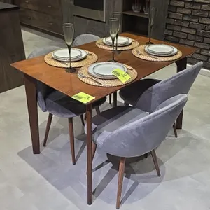 Wood dining table and chairs set. Includes rectangular wood dining table and (4) gray velvet cushioned chairs with tapered wood legs. Dimensions: 48" 