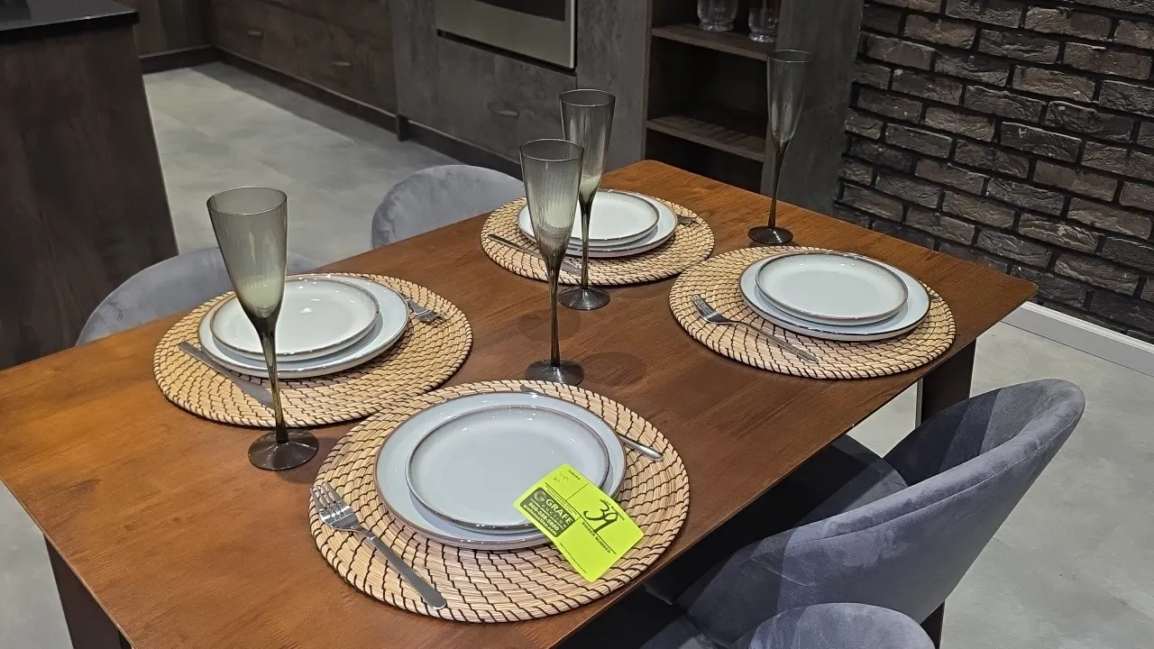 4-place setting dining smallwares set. Includes (4) round woven placemats, (8) ceramic plates, (4) smoked glass flutes, and stainless flatware (forks