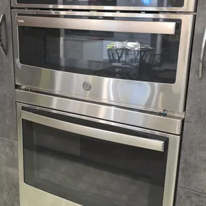 2022 GE Profile PT7800SH9SS 30" built-in combination microwave wall oven. Features upper microwave/convection oven with glass turntable and wire rack,
