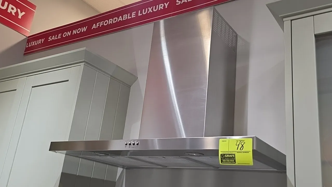 Whirlpool WVW57UC6FS3 stainless steel range hood vent. Features push-button fan and light controls, mesh grease filters, integrated cooktop lighting,