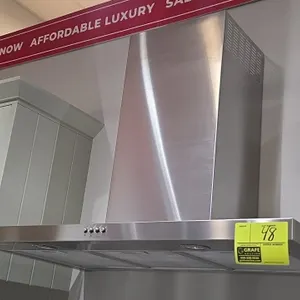 Whirlpool WVW57UC6FS3 stainless steel range hood vent. Features push-button fan and light controls, mesh grease filters, integrated cooktop lighting, 