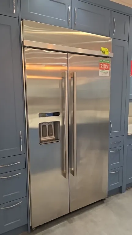 JennAir JS42PPDUDE01 42" built-in side-by-side refrigerator. Features stainless steel finish, Obsidian black interior, exterior ice and water dispense