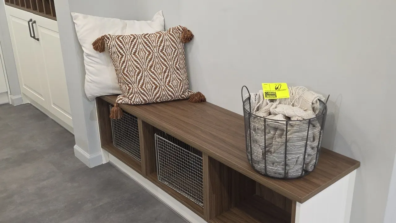 Assorted decorative smallwares and home accents. Includes wire basket with throw blanket, accent pillows, wire storage baskets, faux potted plant in c