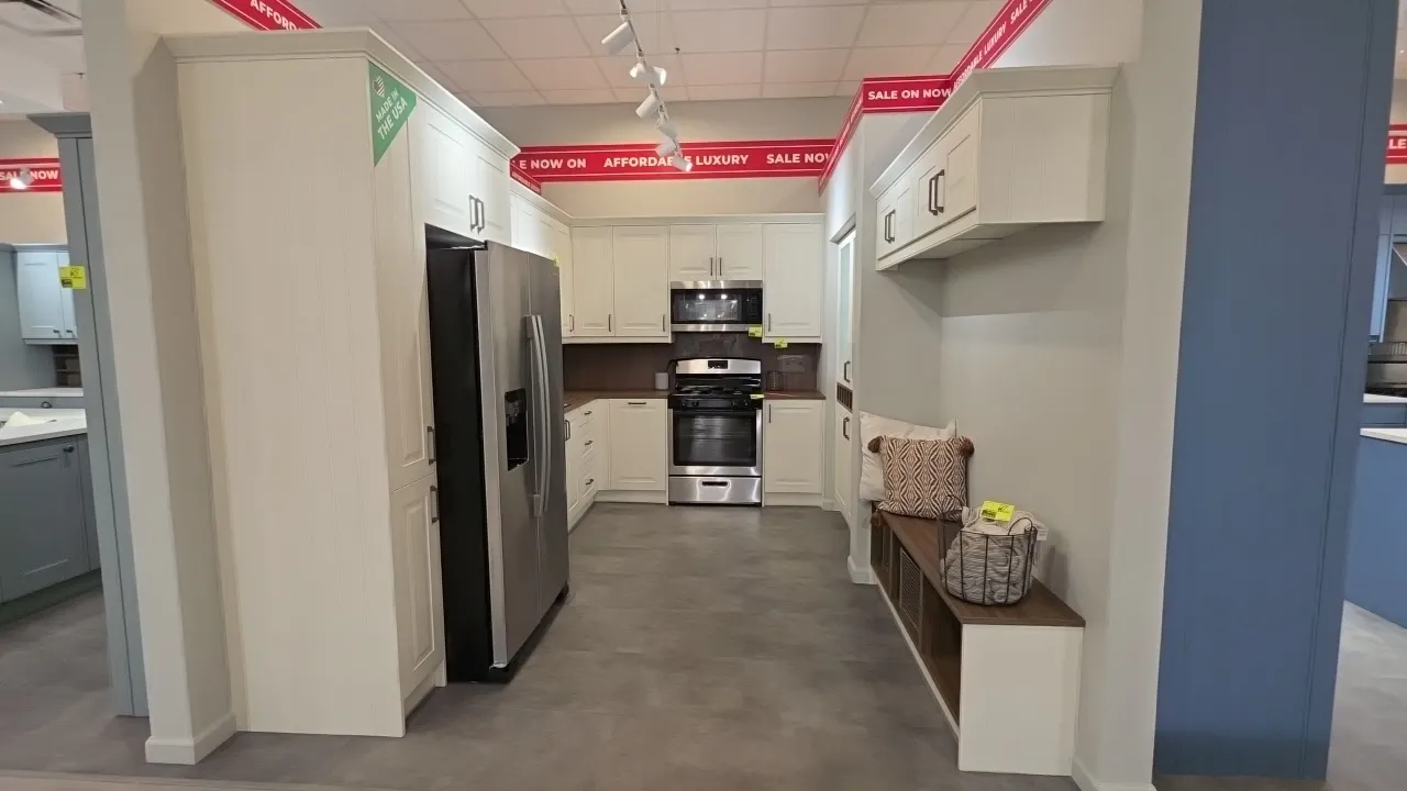 Wren Kitchens Infinity Plus kitchen cabinet suite. Includes 70" x 97" L-shape upper and lower cabinets with laminate countertops, backsplash, and stai