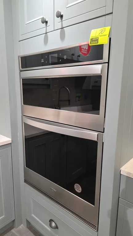2022 Whirlpool WOC54EC0HS20 30" built-in microwave combination oven. Features stainless steel finish with glass front doors, digital touchscreen contr