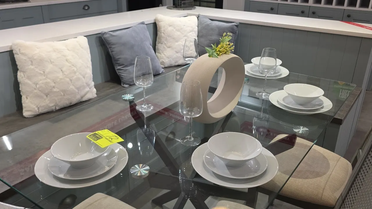 Assorted decorative kitchen and dining smallwares. Includes white ceramic dinnerware place settings (plates and bowls), wine glasses, textured glasswa