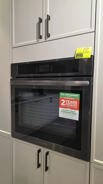 Frigidaire FCWS3027ADC 30" built-in wall oven. Features stainless steel finish, glass door, digital touch controls, rear convection fan, and (2) wire