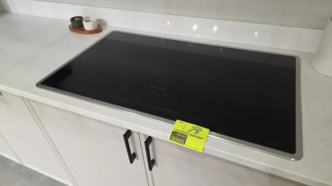 KitchenAid KICU669XSS 36" built-in 5-element induction cooktop. Features stainless steel perimeter trim, digital touch controls, bridge zone, power bo