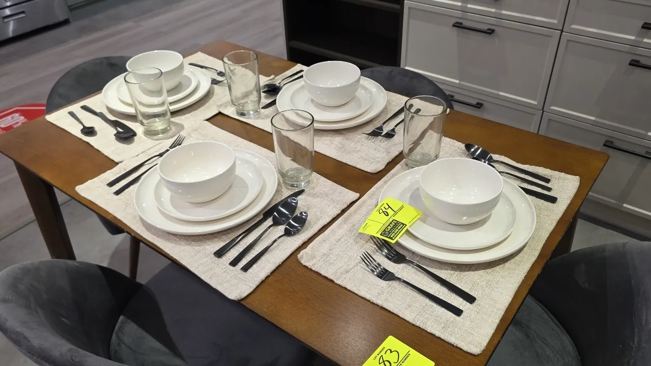 Assorted kitchen and dining smallwares. Includes dinnerware sets (plates, bowls), flatware, drinking glasses, glass mugs, placemats, decorative pitche