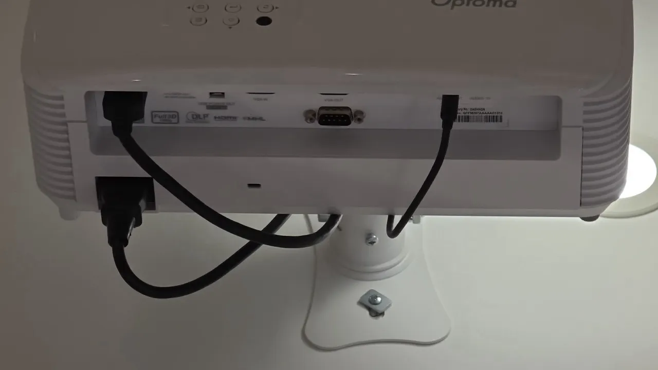 Optoma ceiling-mounted projector with in-ceiling speaker. Features DLP technology, Full 3D support, HDMI, MHL, and VGA connectivity, top-panel manual