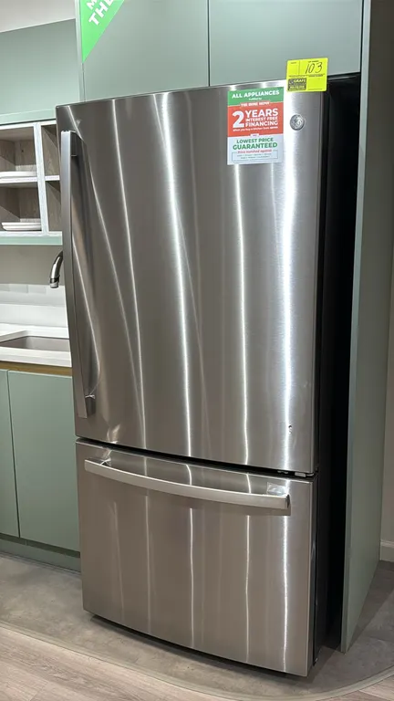GE GDE25EYKERFS 24.8 cu. ft. bottom-freezer refrigerator. Features stainless steel finish, bottom pull-out freezer drawer, adjustable interior glass s
