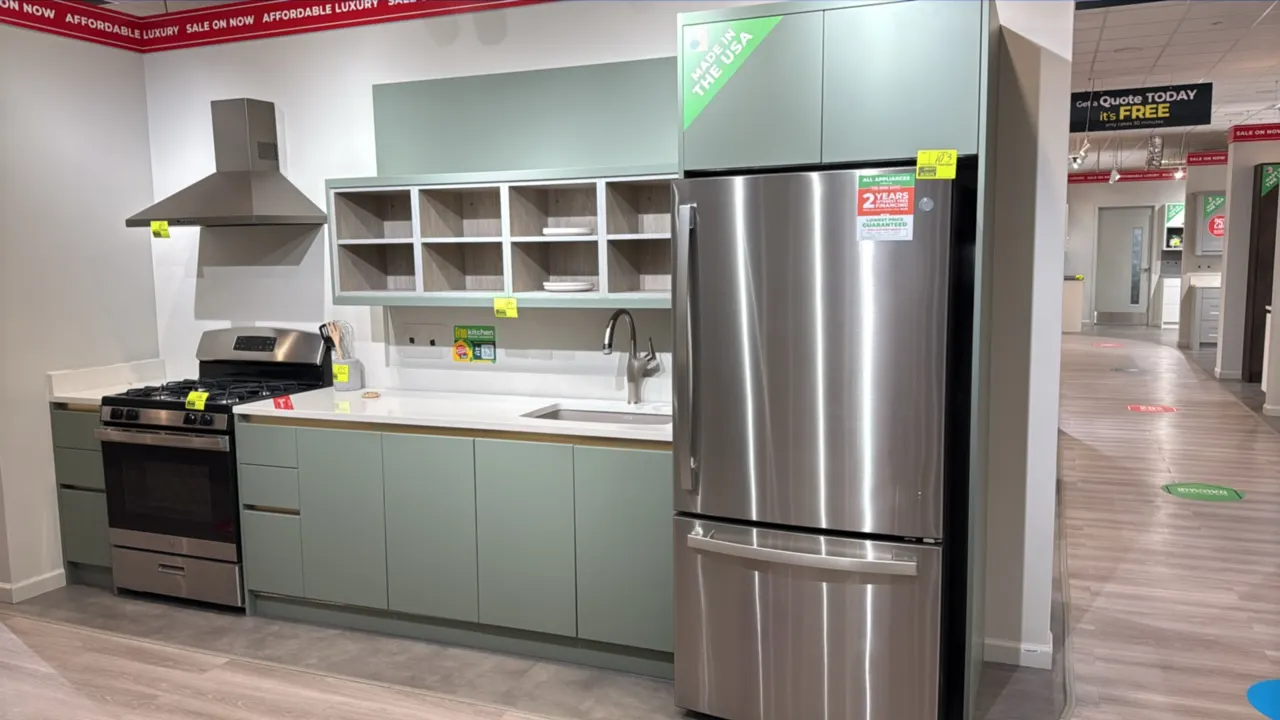 Wren Kitchens Infinity Plus kitchen cabinet suite. Features quartz countertop, Blanco undermount sink, single-handle pull-down faucet, open upper shel