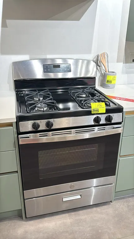 GE JGBS60REK5SS 30" freestanding gas range and oven. Features 4 gas burners with grates, front control knobs, digital display with clock and timer, ov