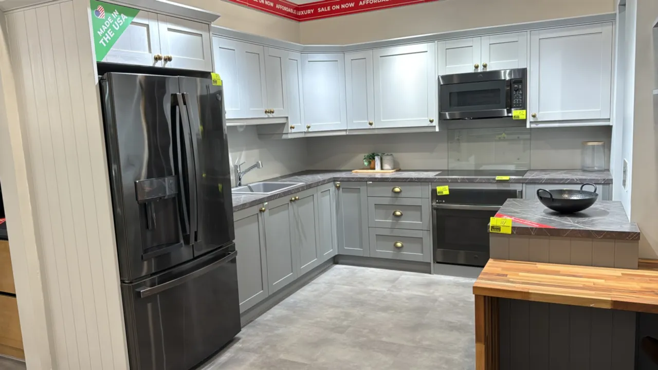 Infinity Plus kitchen cabinet set. Includes 106" x 95" x 87"H L-shaped cabinets with laminate countertop and sink with faucet, 37" x 42" x 37" x 87"H