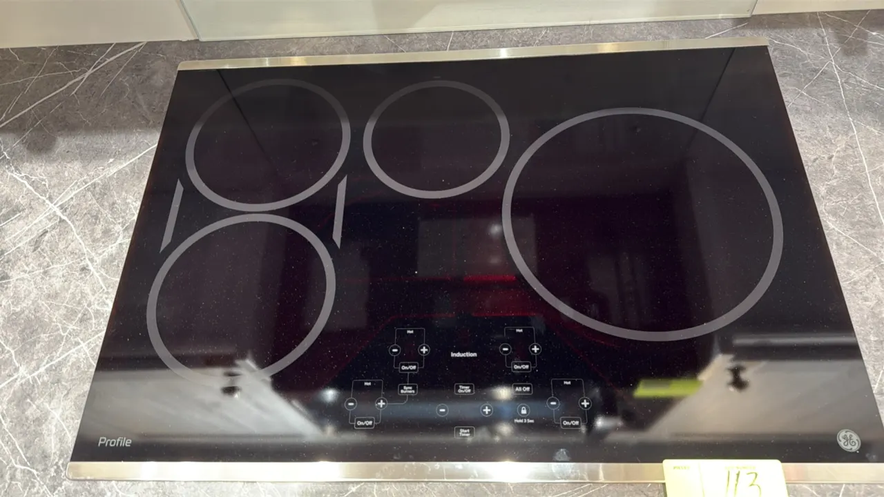 GE Profile PHP9030SJ6SS 30" built-in induction cooktop. Features 4 induction heating zones, digital touch controls, sync burners capability, control l