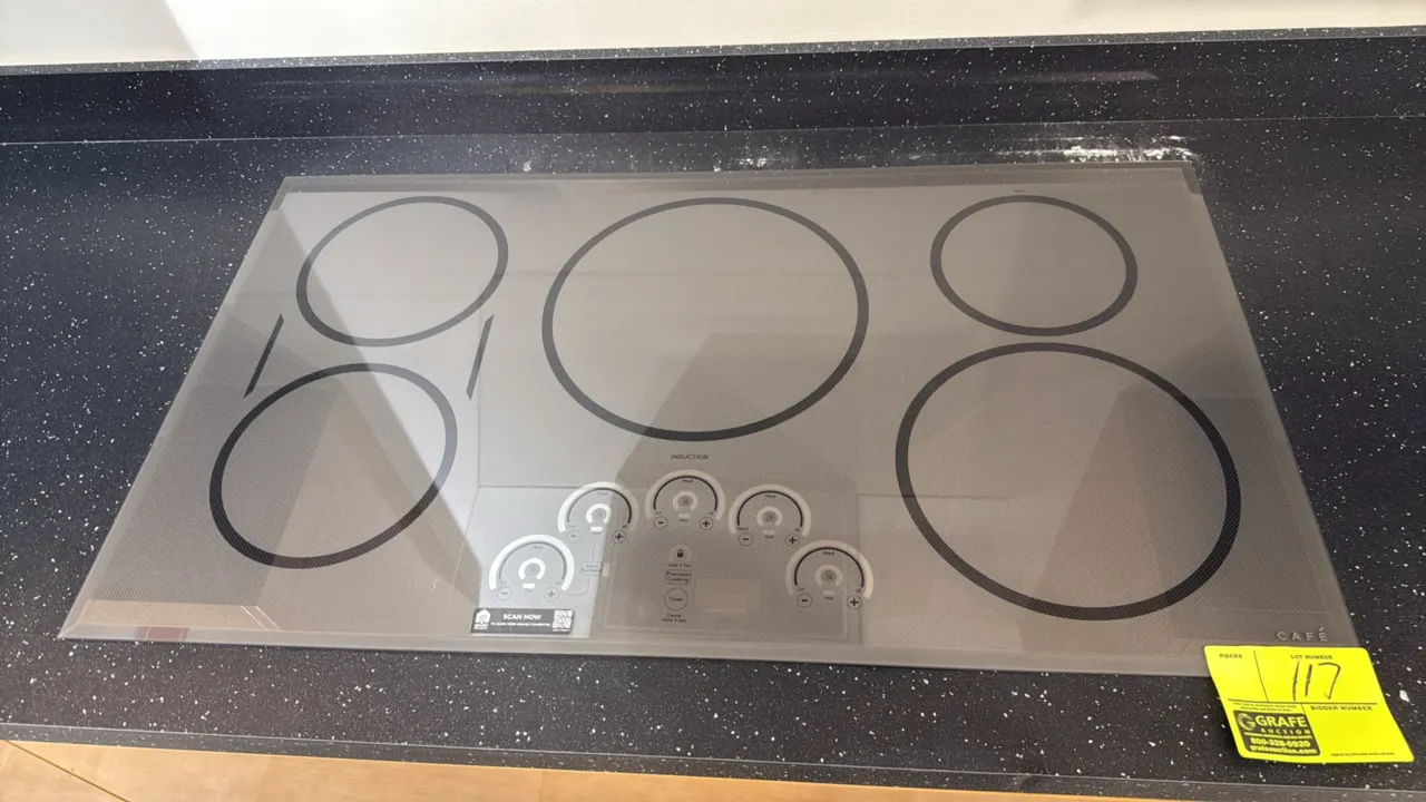 Café CHP95362M4SS induction cooktop. Features 5 induction heating elements, smart digital touch controls, sync burners function, and integrated timer.