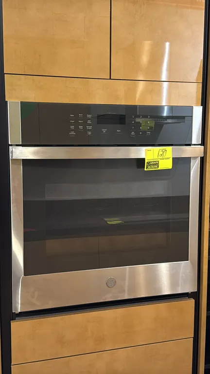 GE JKS3000SN1SS smart built-in single wall oven. Features stainless steel finish, digital touch controls with Wi-Fi Connect, interior lighting, and tw