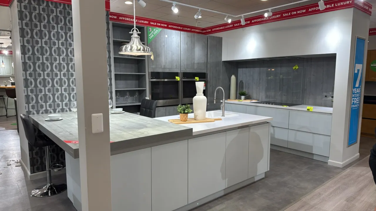 Infinity Plus kitchen cabinet set with sink and faucet. Includes 100" base cabinet with laminate countertop, 110" x 96"H tall cabinet wall, and 96" x