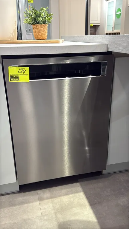 KitchenAid KDPM604KPS0 undercounter dishwasher. Features stainless steel finish, hidden top controls, 3-tier rack system with silverware basket, and P