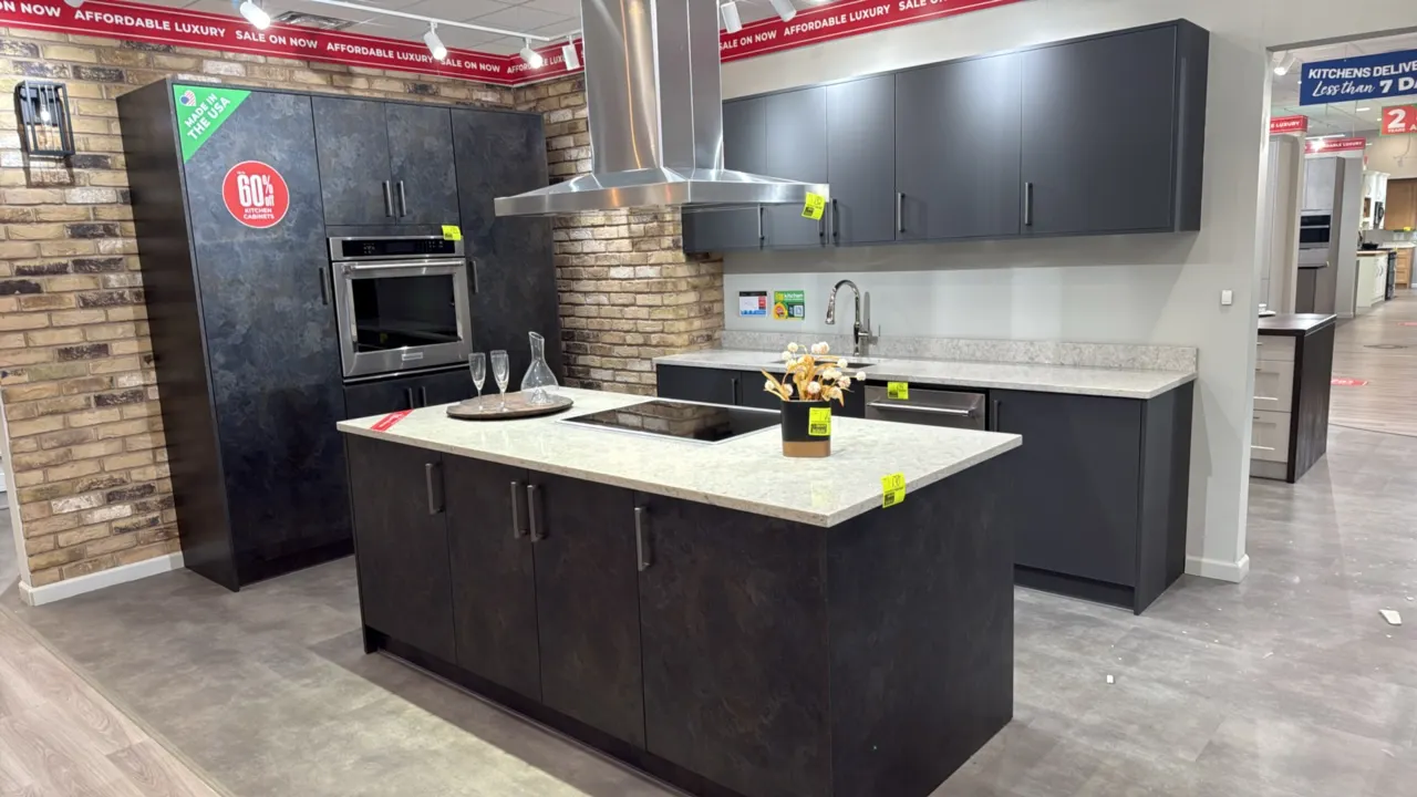 Infinity Plus kitchen cabinet set. Features quartz countertops, stainless steel undermount sink, gooseneck pull-down faucet, 105"L cabinet run with up