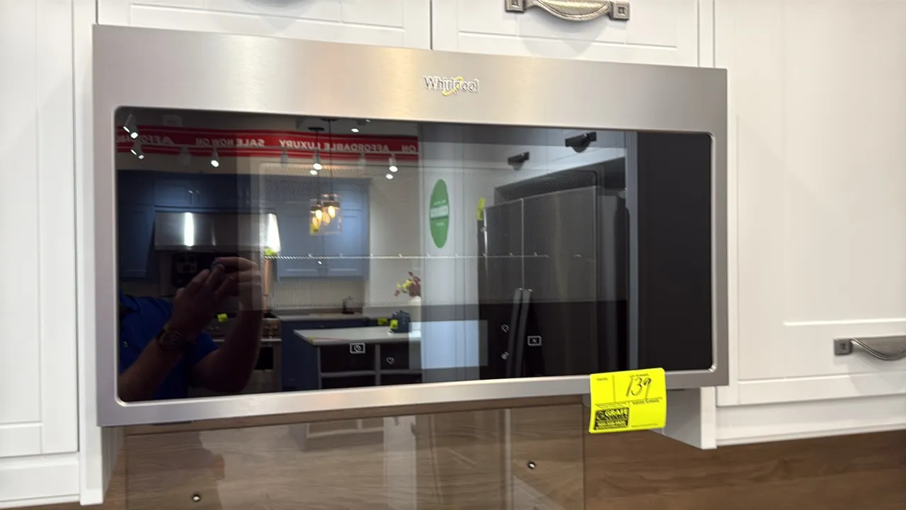 2021 Whirlpool WMHA9019HZ04 over-the-range microwave oven. Features stainless steel finish, integrated glass touchscreen controls, interior wire rack