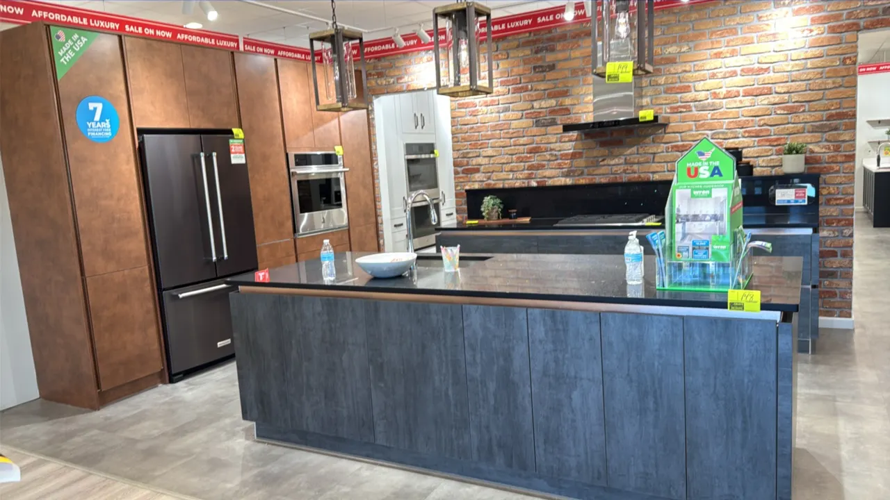 Infinity Plus kitchen cabinets. Features quartz countertops, stainless steel sink with faucet, 107.5" x 41" island cabinets, 130" x 96.5"H wall cabine