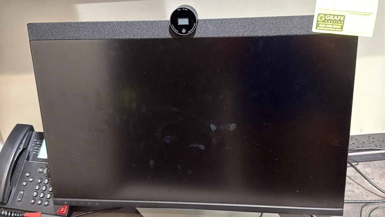 Dell 27" computer monitor with webcam. Features top-mounted Dell 2K QHD camera with AI auto framing and HDR, integrated top speaker bar, and adjustabl