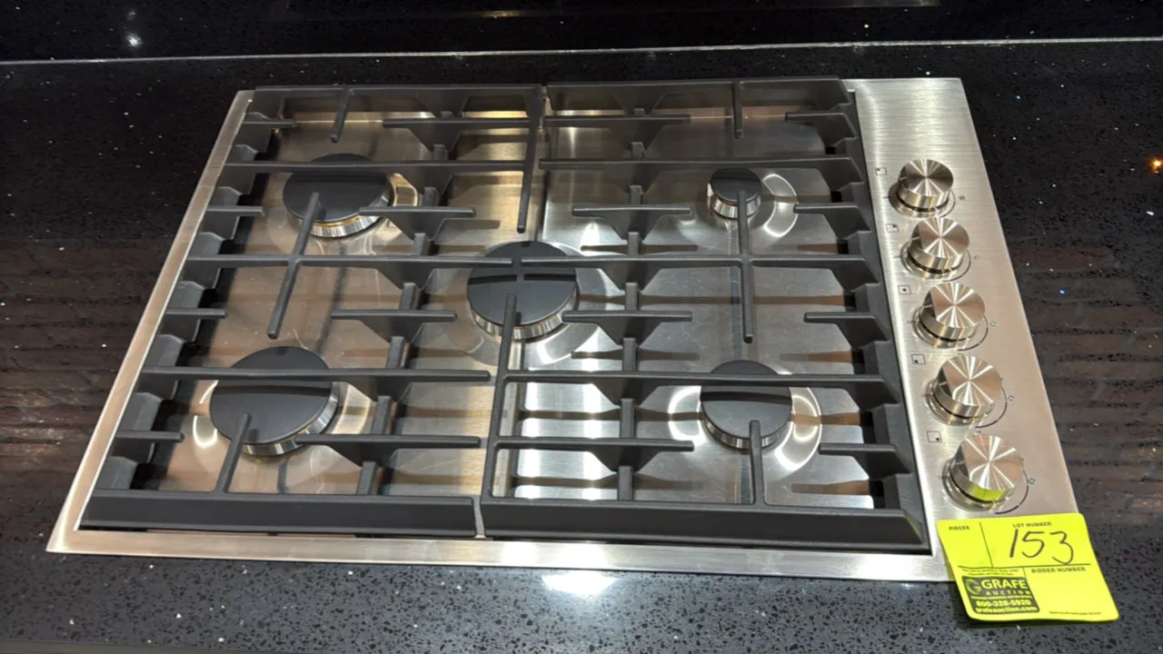 JennAir JGC7530BS01 30" 5-burner built-in gas cooktop. Features stainless steel finish, continuous cast iron grates, and side rotary control knobs. S/