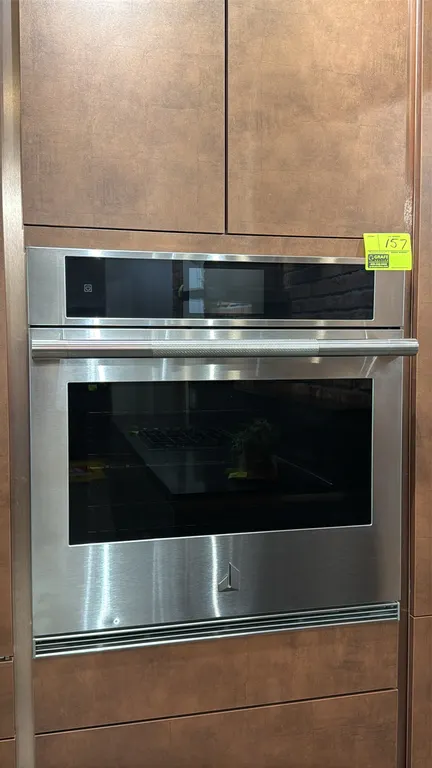 JennAir JJW3430LL00 30" built-in convection wall oven. Features stainless steel exterior, knurled bar handle, digital touchscreen display, dual convec
