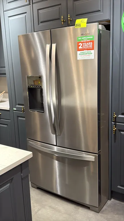 Whirlpool WRF757SDHZ03 French door refrigerator. Features stainless steel finish, bottom pull-out freezer drawer, in-door ice and water dispenser, adj